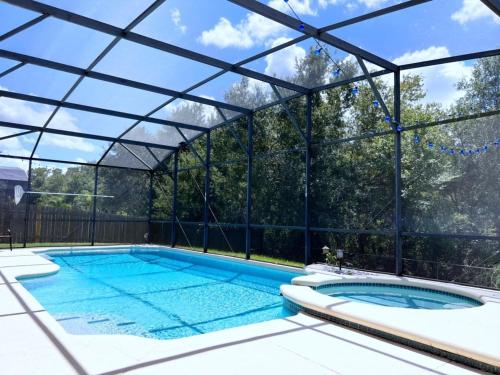 Privacy 4 Bed 3 Bath Pool Home with Spa home in Kissimmee, USA