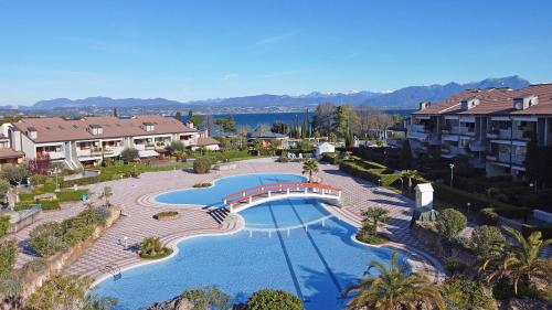 Úszómedence, I Ciliegi 1/09 con piscina by Wonderful Italy in Santa Maria di Lugana