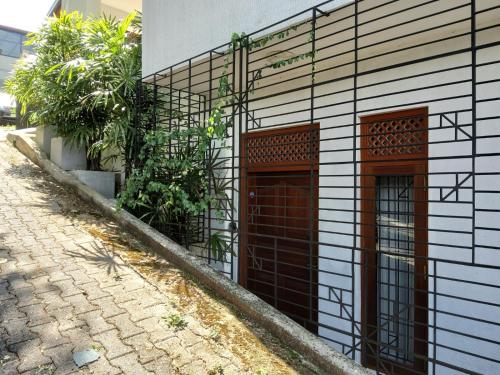 Comfortable and serene cottage surrounded with palms and tamarind tree