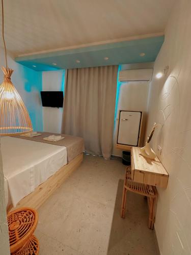 Delfini Beach Hotel & Suites Delfini Beach Hotel & Suites