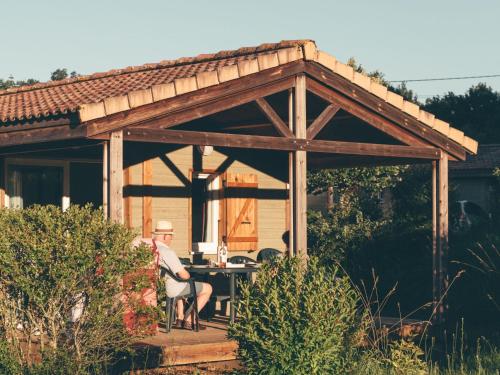 Chalet with a covered terrace on a slope