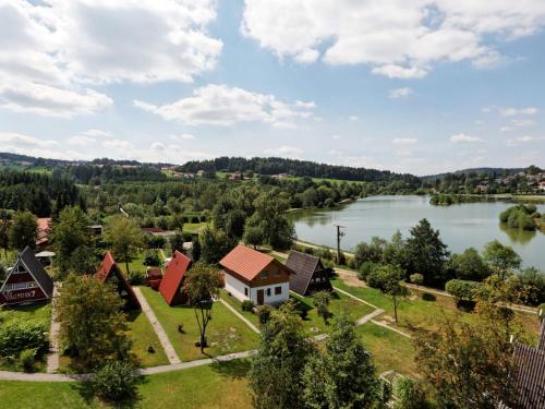 Wooden chalet with terrace near a swimming lake