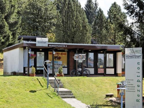 Wooden chalet with terrace near a swimming lake