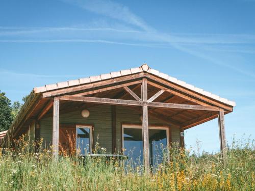 Chalet with a covered terrace on a slope