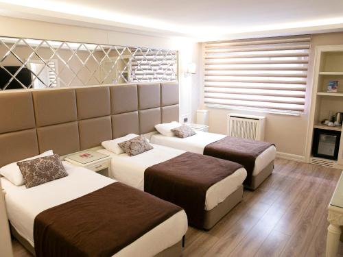 Fimka Hotel Room Type - Deluxe Triple Room