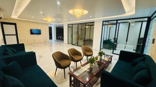 Shared lounge/TV area, Raksha Suites & Banquet Greater Noida in Greater Noida