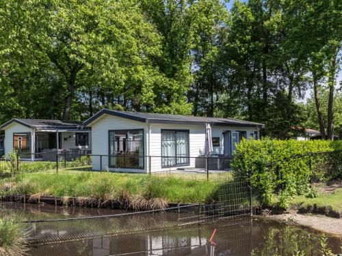 Modern chalet with a terrace and near a pond