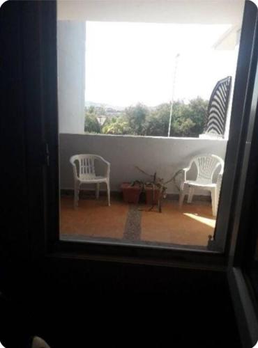 Appartement type andalous avec peintures murales originales grande double terrasse vue sur golf Teel in Saidia