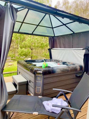 Exterior view of Osada Skoczkowo komfortowe domki z jacuzzi nad jeziorem- sauna- balia- prywatny staw wedkarski