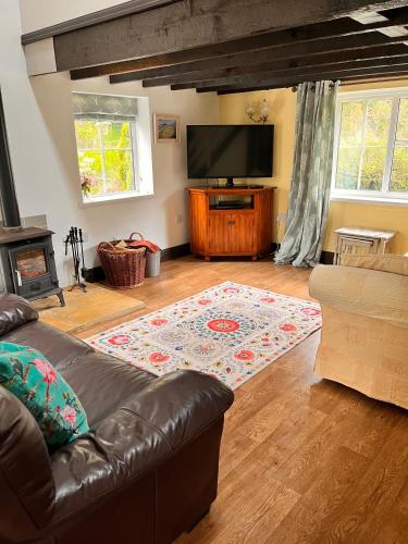 Koplietošanas atpūtas telpa ar TV, Sparrows Nest Holiday Cottage in Amroth