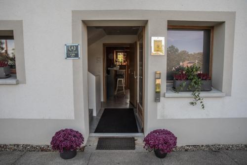 vhod, Le Paysan Horloger in Les Bois