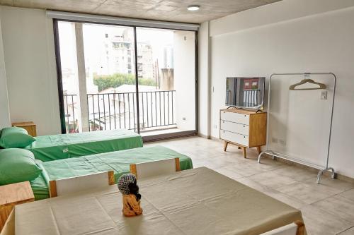 Shared lounge/TV area, Hermosos departamentos cercanos a Hospital Garraham in San Cristóbal