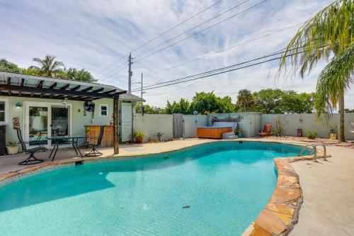 Sunny Tequesta Oasis Hot Tub and Poolside Backyard