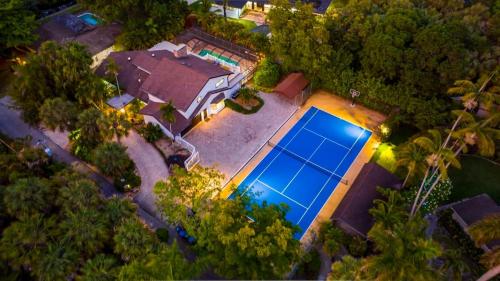 Beautiful 2 House Luxury Estate with all the amenities 10 BR Heated Pool Jacuzzi Tennis Court Basketball Volleyball Movie Theater Large Playground