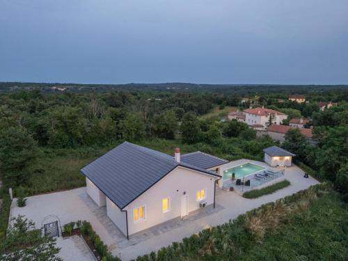 Modern villa with swimming pool and fenced garden