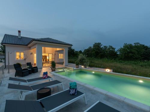 Modern villa with swimming pool and fenced garden