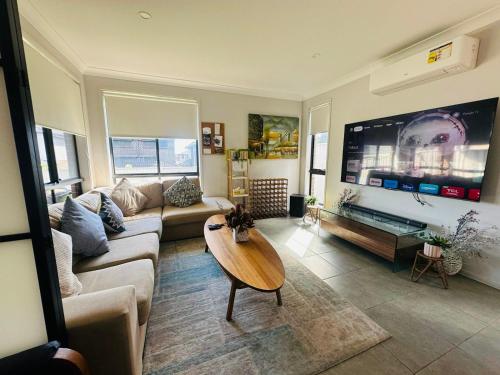 Shared lounge/TV area, Cool Air Austral with AC in South Western Sydney