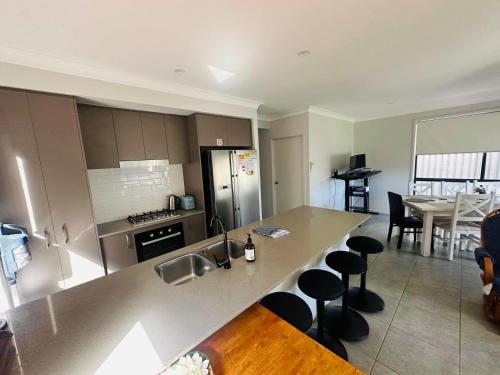 Kitchen, Delightful Austral Stay with AC and built-in wardrobe in South Western Sydney