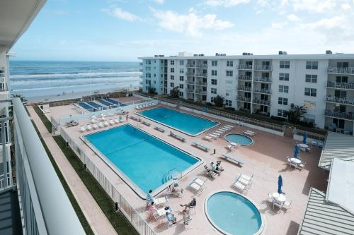 Amazing views of the ocean and pool from this top floor beach retreat! in New Smyrna Beach, USA