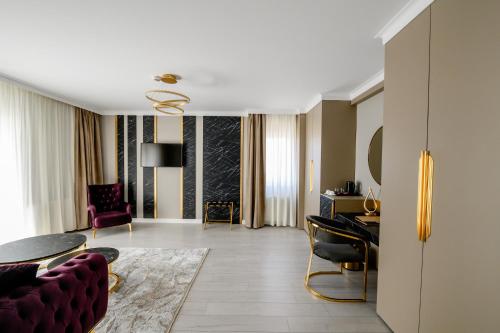 Közös társalgó / TV, Elitte Inn & Suites in Roșu