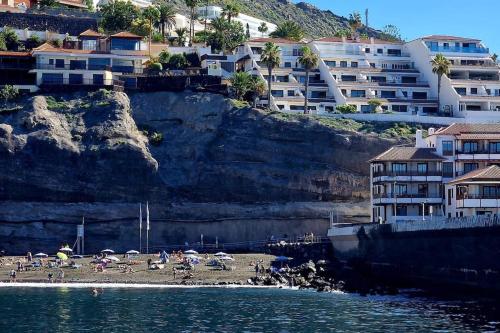 Stunning cliffs and ocean view in Los Gigantes - Tap to explore photos