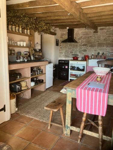 Historic converted byre in courtyard of 16C house