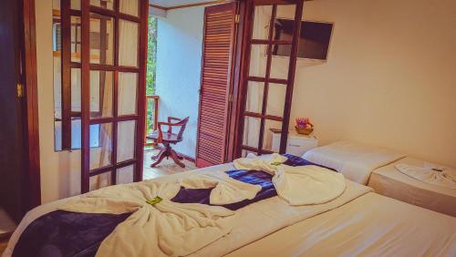 Standard Triple Room room in Pousada Atalaia Capivari