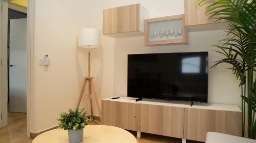Koplietošanas atpūtas telpa ar TV, APARTAMENTO PRADERAS PANTANO SAN JUAN PRIMERA PLANTA in Pelayos de la Presa
