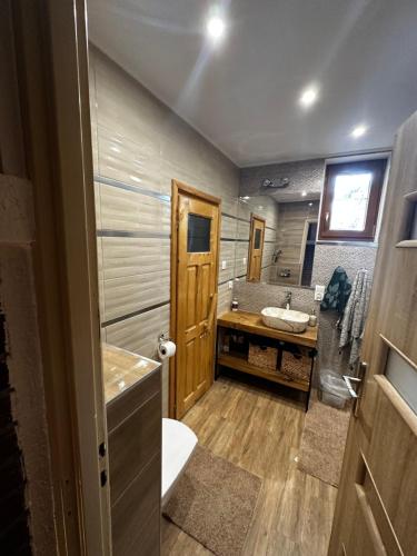 Domek letniskowy w Puszczy Augustowskiej z sauną i balią (Domek letniskowy w Puszczy Augustowskiej z sauna i balia) in Ateny