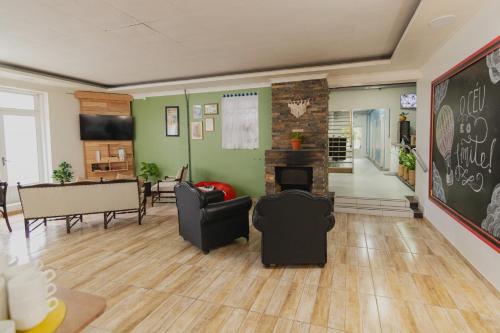 ห้องส่วนกลางสำหรับนั่งเล่น/ดูทีวี, Araucária Hostel e Pousada (Araucaria Hostel e Pousada) in ซาดอ เบนโต โด ซุล