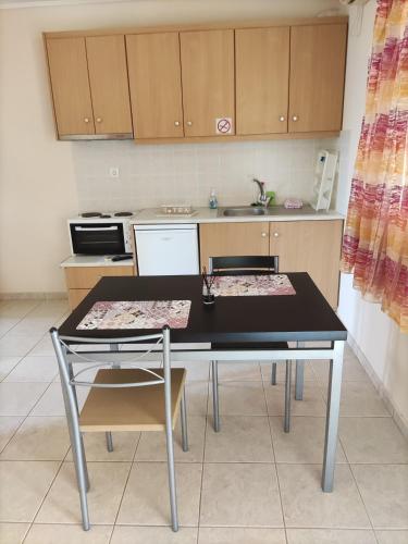 Kitchen, ROMVI VILLAGE in Dexamenes