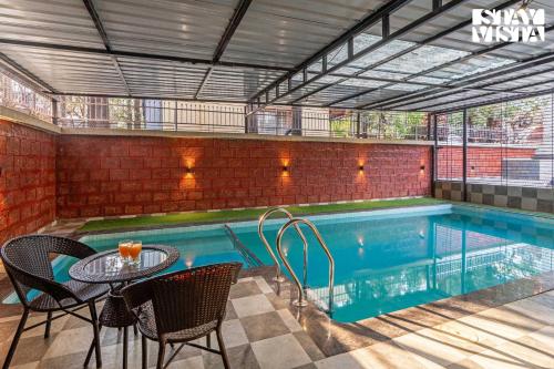 StayVista's Hillside Crest - Pet-friendly villa with Indoor pool, Terrace, & Indoor & Outdoor games