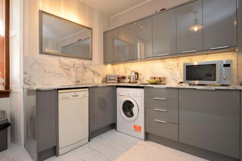 кухня, Janeville Holiday Apartment in Лохгілпхед