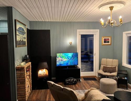 Koplietošanas atpūtas telpa ar TV, Nonholl country cottage - Perfect getaway in Arnarstapi