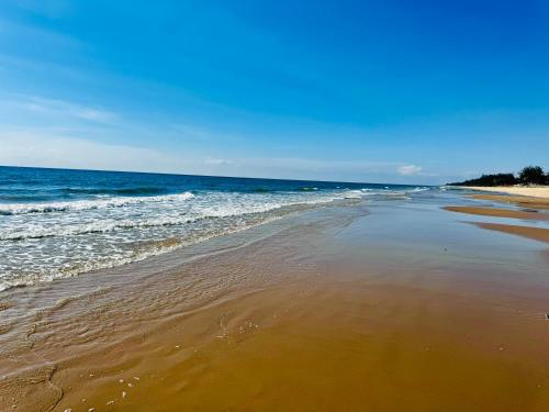 Whispering waves beachfront villa