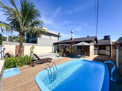 CASA GOLFINHO 348 - casa com piscina e lazer para até 8 pessoas
