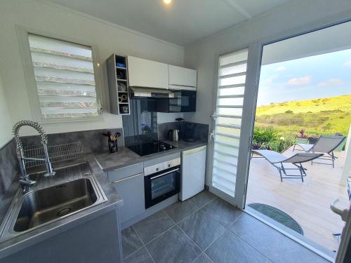 Studio Chez Anna - vue mer et piscine in Le Carbet