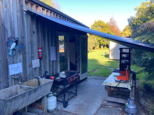 Whare&geothermal pool by lake Taupo in Turangi