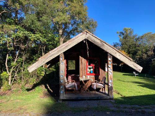 Whare&geothermal pool by lake Taupo in Turangi