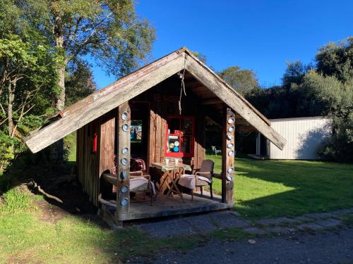 Whare&geothermal pool by lake Taupo in Turangi