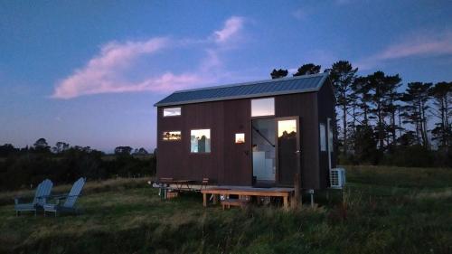 Taranaki Creekside TUI by Tiny Away in Pembroke