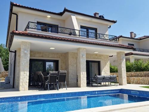 Modern villa with swimming pool and fenced garden