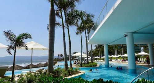 An Iconic beachfront apartment- Peninsula Resort in Nuevo Vallarta , Mexico
