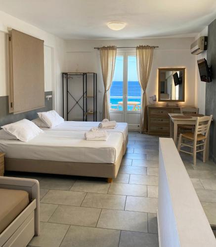 Agnadi Syros Beachfront Studios & Rooms - Tap to explore photos