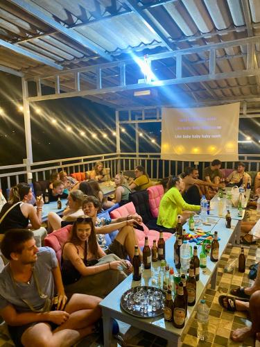 Banquet hall, Sunrise Riverside Pool Hostel in Luang Prabang