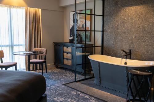 King Suite with Sofa Bed and Free-Standing Bath