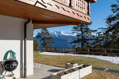 Le Saint Georges l Jardin et vue Crans Montana