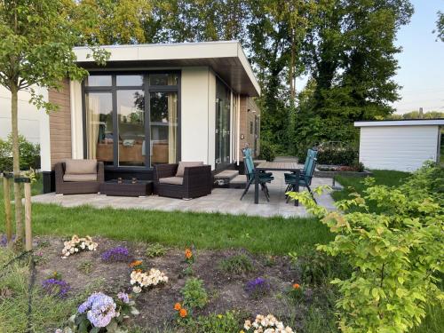Jardín, Kindvriendelijk luxe chalet in de bossen met privé sauna (Kindvriendelijk luxe chalet in de bossen met prive sauna) in Harderwijk
