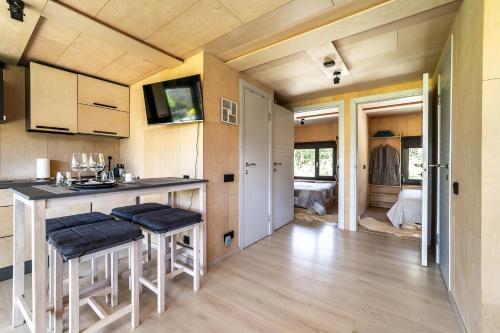 A tiny house with a garden and a hot tube