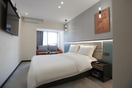 ห้องส่วนกลางสำหรับนั่งเล่น/ดูทีวี, 云泊青年酒店乌鲁木齐高铁站店 Yunbo Youth Hostel Ürümqi (云泊青年酒店乌鲁木齐高铁站店 Yunbo Youth Hostel Urumqi) in อุรุมชี